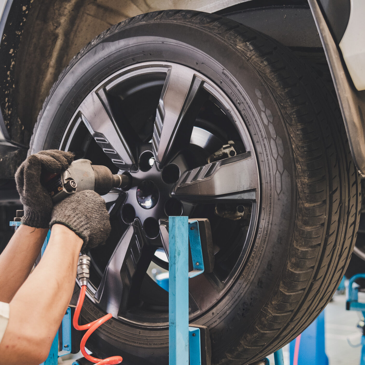 The car mechanic is changing the tire.